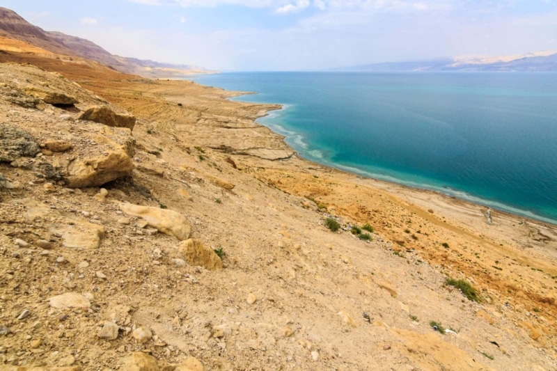 Toasted land next to the turquoise Dead Sea