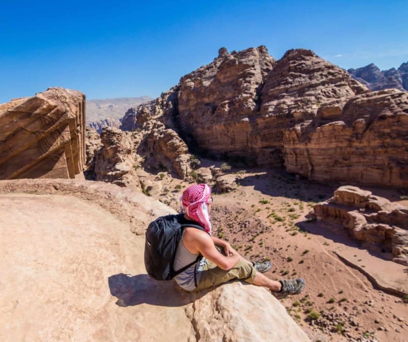Sitting on the top of the Monastery in Petra, Jordan.