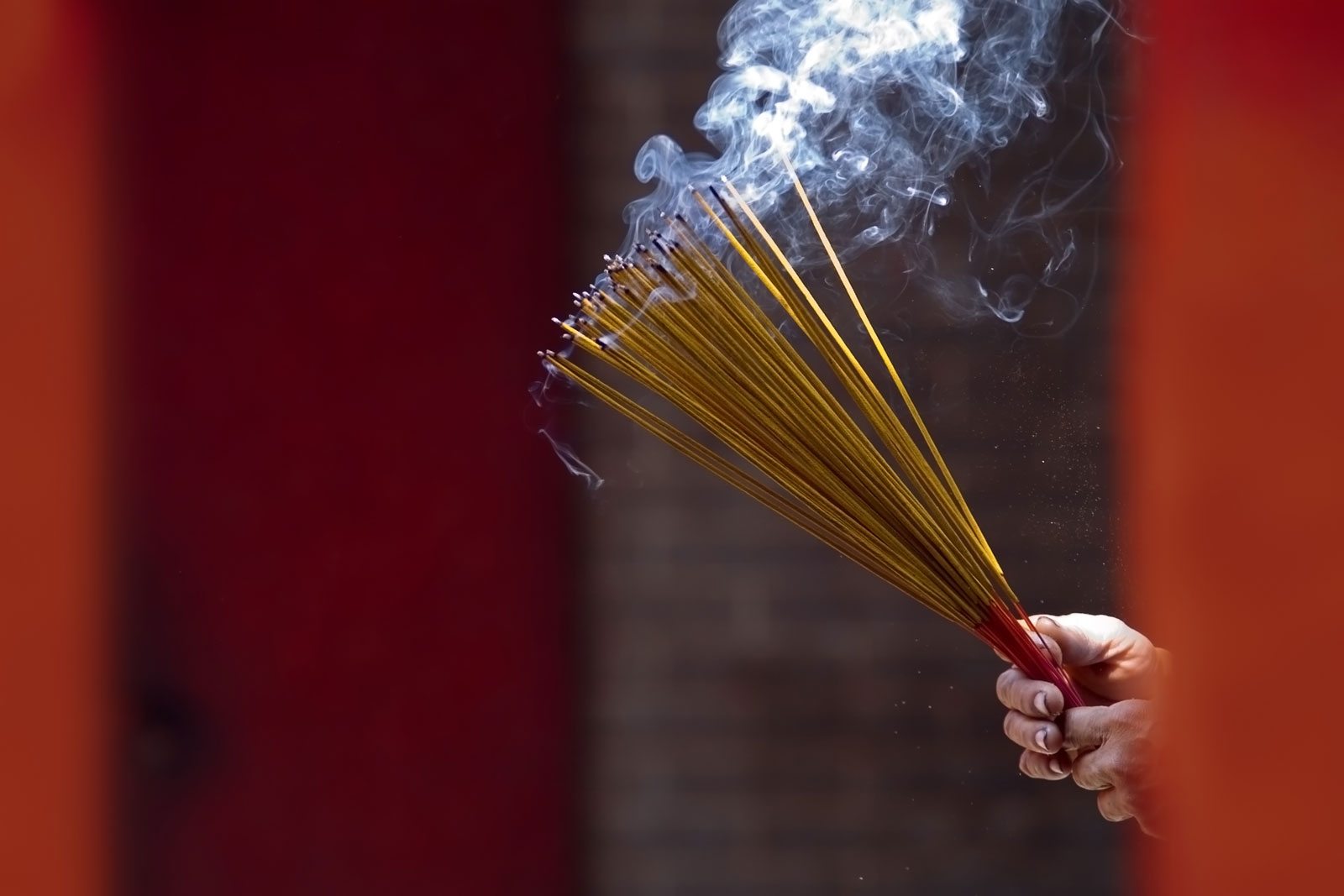 Burning incense at a temple in Ho Chi Minh City, Vietnam