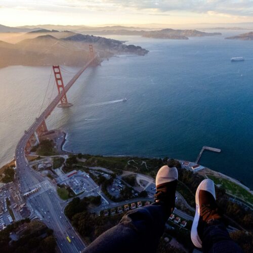 Hanging out of a helicopter above the Golden Gate Bridge