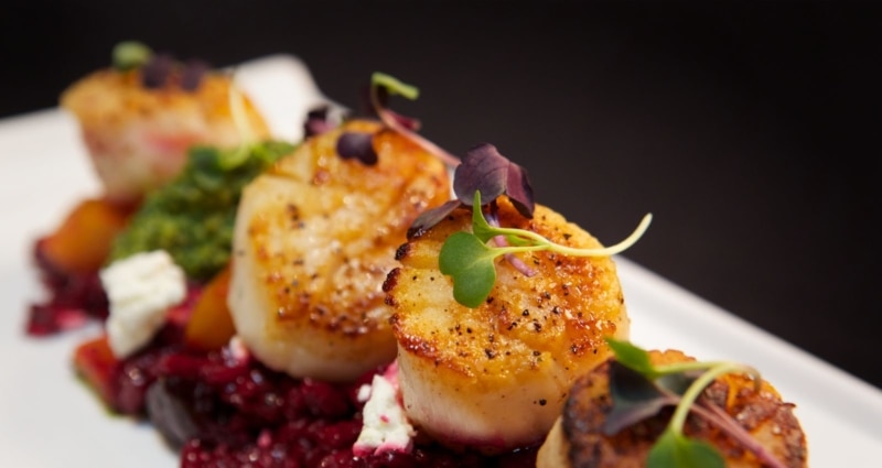 Seared sea scallops from Posana, one of the best places to eat in Asheville
