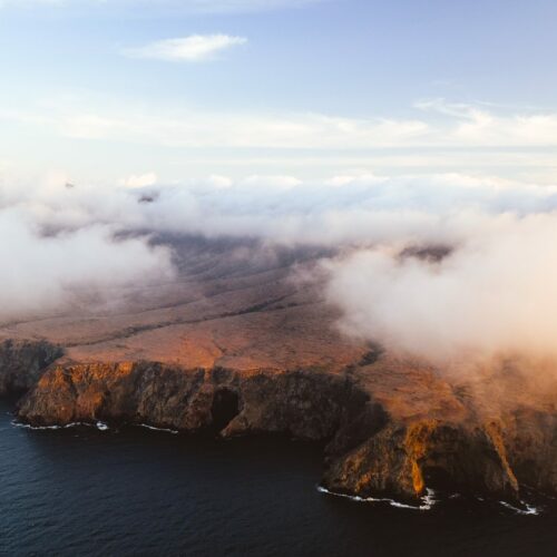 Clouds rolling in over Santa Cruz Island, shot from a helicopter
