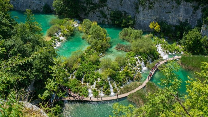 Exploring Plitivice waterfalls during your travels in May.