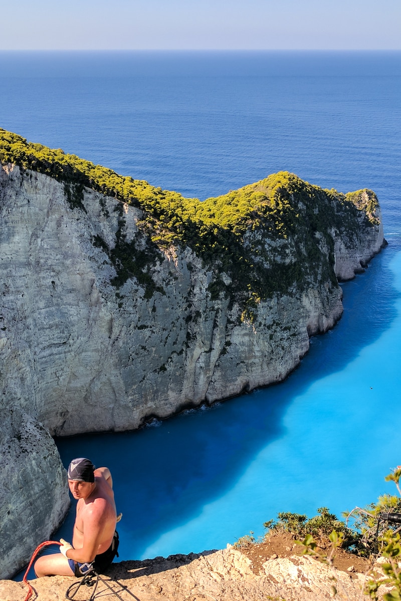 Rope jumping from the top of Navagio Beach