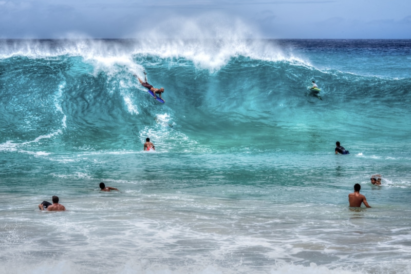 A group of bodyboarders at Sandy Beach