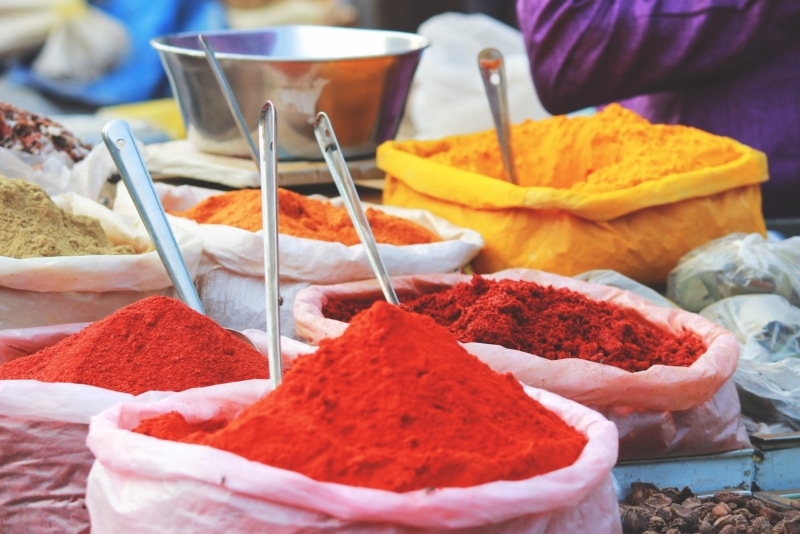 Bags of red spices at a market in Morocco