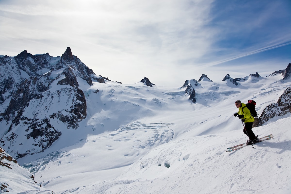 Male skier moving down in snow powder; envers du plan, vallèe blanche, Chamonix, Mont Blanc massif, France, Europe.